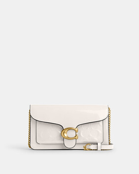 كلاتش تابي بسلسلة جلد بشعار الماركة